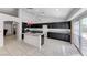 Spacious kitchen featuring dark cabinets, granite countertops and stainless steel appliances at 3413 Freestone Ln, North Las Vegas, NV 89032