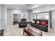 Inviting living room featuring tile floors, comfortable seating, and a well-lit open layout at 3413 Freestone Ln, North Las Vegas, NV 89032
