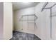 This walk-in closet features adjustable metal shelving, providing efficient storage space for clothes and accessories at 3413 Freestone Ln, North Las Vegas, NV 89032
