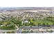 Aerial view of park with covered picnic area, green space, and community at 3483 French Daisy St, Las Vegas, NV 89135