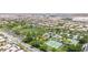 Aerial view of community park with playground, tennis courts and basketball court at 3483 French Daisy St, Las Vegas, NV 89135