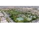 Aerial view of community park with playground, tennis courts and basketball court at 3483 French Daisy St, Las Vegas, NV 89135