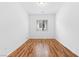 This bedroom features wood floors, a window and neutral colored walls at 3483 French Daisy St, Las Vegas, NV 89135