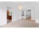 Dining room with decorative chandelier with doorway views to the kitchen and other living areas at 3483 French Daisy St, Las Vegas, NV 89135