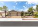 Inviting single-story home featuring a three-car garage and well-manicured front yard at 3483 French Daisy St, Las Vegas, NV 89135