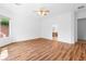 Bright, open room with hardwood floors and a view to the bathroom and toilet at 3483 French Daisy St, Las Vegas, NV 89135