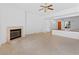 Bright living room area with a fireplace, tile floors, and neutral paint at 3483 French Daisy St, Las Vegas, NV 89135