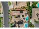 Birds-eye view of a home with solar panels, a pool, and a landscaped yard in a residential neighborhood at 3614 Coventry Gardens Dr, Las Vegas, NV 89135