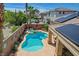 Inviting backyard with pool, spa, covered patio, and lush landscaping creating a private outdoor retreat at 3614 Coventry Gardens Dr, Las Vegas, NV 89135