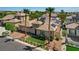 Attractive single-story home featuring desert landscaping, palm trees, solar panels and a brick paved driveway at 3614 Coventry Gardens Dr, Las Vegas, NV 89135