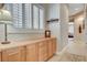 Hallway featuring built-in cabinetry with ample storage and a view of the bedroom at 3614 Coventry Gardens Dr, Las Vegas, NV 89135