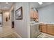 Functional laundry room with modern washer and dryer, cabinets, and a utility sink at 3614 Coventry Gardens Dr, Las Vegas, NV 89135