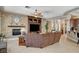 Comfortable living room with a stacked stone fireplace and built-in entertainment center at 3614 Coventry Gardens Dr, Las Vegas, NV 89135