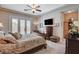Spacious main bedroom featuring tray ceilings, and access to the backyard pool at 3614 Coventry Gardens Dr, Las Vegas, NV 89135