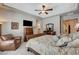 Large main bedroom boasts a ceiling fan and comfortable sitting area at 3614 Coventry Gardens Dr, Las Vegas, NV 89135