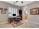 Cozy home office with custom desk, shelving, and abundant natural light at 3614 Coventry Gardens Dr, Las Vegas, NV 89135