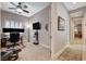 Bright office with modern ceiling fan, dual monitors, and comfortable work space at 3614 Coventry Gardens Dr, Las Vegas, NV 89135