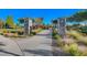 Stone monuments mark a beautifully landscaped park entrance, inviting strolls along the paved walkway at 3614 Coventry Gardens Dr, Las Vegas, NV 89135