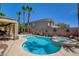 Private backyard pool and spa area with lush landscaping and covered outdoor seating at 3614 Coventry Gardens Dr, Las Vegas, NV 89135