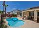 Relaxing backyard oasis with a sparkling pool, spa, and covered patio at 3614 Coventry Gardens Dr, Las Vegas, NV 89135