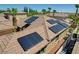 Tiled roof featuring solar panels for energy efficiency on a multi-story home in a residential neighborhood at 3614 Coventry Gardens Dr, Las Vegas, NV 89135