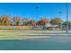 Well-kept tennis court with net and seating, perfect for recreational play within the community at 3614 Coventry Gardens Dr, Las Vegas, NV 89135