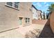 Private backyard featuring low maintenance gravel, and a paved patio with access door at 378 Gracious Way, Henderson, NV 89011