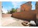 Cozy backyard with brick-paved patio, gravel, and a charming fire pit seating area at 378 Gracious Way, Henderson, NV 89011