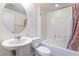 Bathroom with white vanity, sink, toilet, and combined shower and tub at 378 Gracious Way, Henderson, NV 89011