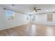 Bedroom showcasing large windows, wood flooring, and modern ceiling fan at 378 Gracious Way, Henderson, NV 89011