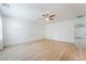 Large bedroom with light wood floors, ceiling fan, and bright natural light at 378 Gracious Way, Henderson, NV 89011