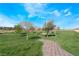 Serene community park with walking path and mature landscaping at 378 Gracious Way, Henderson, NV 89011