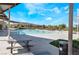 A stunning community pool with picnic benches and a picturesque mountain view against a beautiful blue sky at 378 Gracious Way, Henderson, NV 89011