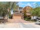 Charming two-story home with stone accents, a two-car garage, and landscaped front yard at 378 Gracious Way, Henderson, NV 89011