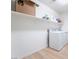 Laundry room featuring white washer and dryer, and storage shelf at 378 Gracious Way, Henderson, NV 89011