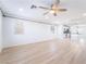 Bright, open-concept living room featuring a ceiling fan and light wood flooring at 378 Gracious Way, Henderson, NV 89011