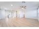 Spacious open-concept living room featuring hardwood floors, recessed lighting, and neutral walls at 378 Gracious Way, Henderson, NV 89011