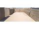 Empty roof deck with stucco privacy walls and a smooth concrete floor at 378 Gracious Way, Henderson, NV 89011