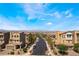 Street view of a neighborhood with well-maintained homes and landscaping at 378 Gracious Way, Henderson, NV 89011