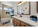 Large bathroom with bright vanity, shower, tub, and tile surround at 3880 Rudek St, Pahrump, NV 89061