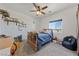 Cozy bedroom featuring natural light, ceiling fan and closet with modern barn door at 3880 Rudek St, Pahrump, NV 89061