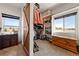 Bright closet featuring a sliding barn door, shelving, hanging rods, with a nice view through the windows at 3880 Rudek St, Pahrump, NV 89061
