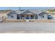 Charming single-story home featuring a covered front porch and desert landscaping at 3880 Rudek St, Pahrump, NV 89061