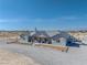 Charming single-story home with grey exterior, covered porch, and well-manicured gravel driveway at 3880 Rudek St, Pahrump, NV 89061