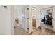 Hallway displaying doors into multiple bedrooms and baths at 3880 Rudek St, Pahrump, NV 89061