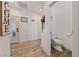 Hallway view featuring wood look floors and a half bathroom at 3880 Rudek St, Pahrump, NV 89061