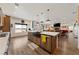 Spacious open-concept kitchen with an island and stainless steel appliances flows into the living area at 3880 Rudek St, Pahrump, NV 89061