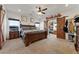 Spacious main bedroom features a large bed, a barn-door closet, and a ceiling fan at 3880 Rudek St, Pahrump, NV 89061