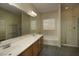 Bathroom with a double sink vanity, separate shower, and soaking tub at 4017 Gliding Gulls Ave, North Las Vegas, NV 89084