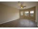 Bright bedroom with sleek flooring and a ceiling fan at 4017 Gliding Gulls Ave, North Las Vegas, NV 89084